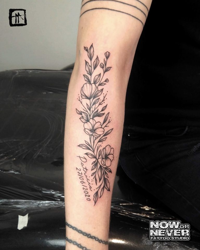 black and grey flowers for women done at Now or Never Tattoo Studio Barcelona